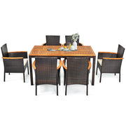 Costway - 7 Pieces Patio Rattan Dining Set with Armrest Cushioned Chair and Umbrella Hole