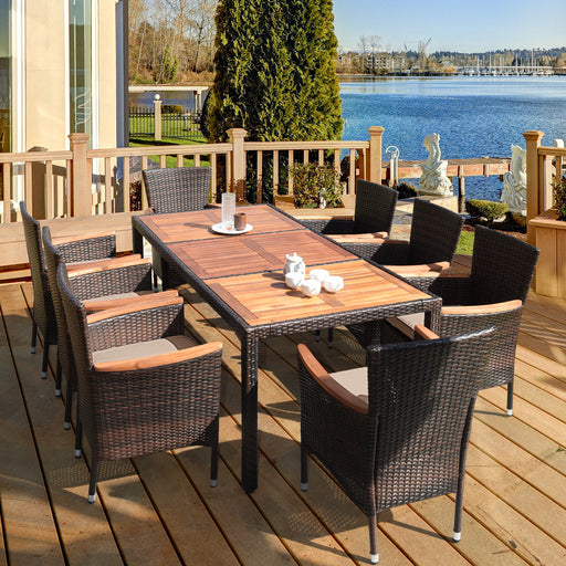 Costway - 9 Pieces Rattan Dining Set with Acacia Wood Table and Stackable Cushioned Chairs