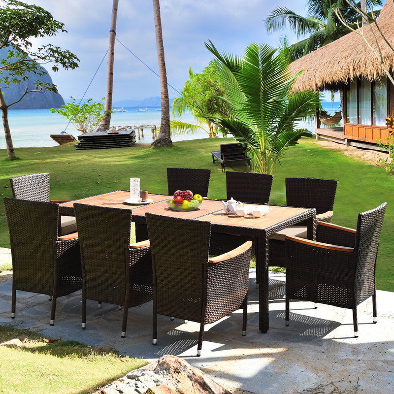Costway - 9 Pieces Rattan Dining Set with Acacia Wood Table and Stackable Cushioned Chairs