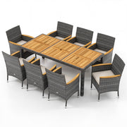 Costway - 9 Pieces Rattan Patio Dining Set with Acacia Wood Table and Cushioned Chair