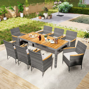 Costway - 9 Pieces Rattan Patio Dining Set with Acacia Wood Table and Cushioned Chair