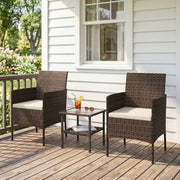 Outsunny - Wicker Bistro Set, 3 Piece Patio Furniture Set with 2-Tier Glass Top Table, Cushions for Balcony, Porch, Khaki